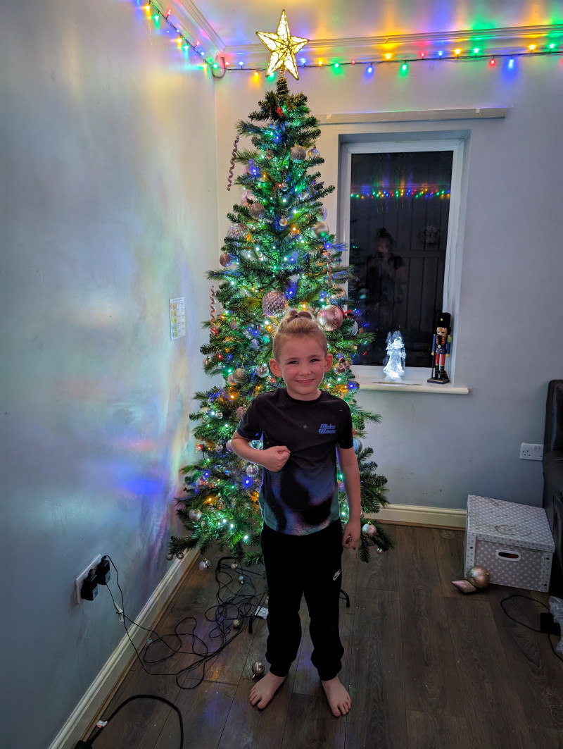 Image for My boy in front of our Christmas Tree 🎄