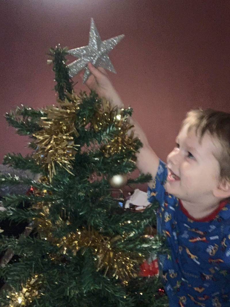 Image for 134. My little grandson Declan is so excited to put the star on his tree