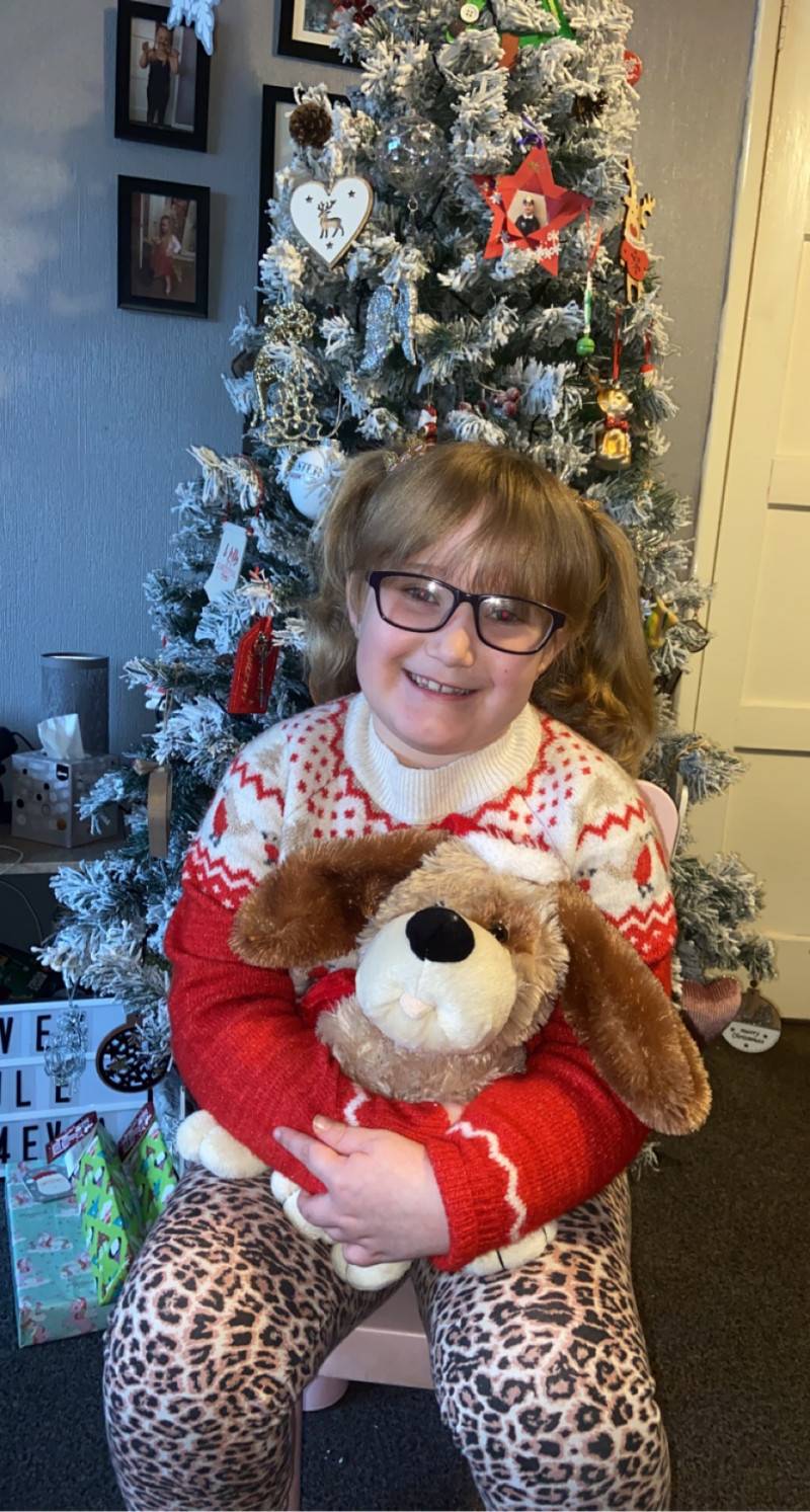 Image for 118. Caitlin and one of her many Xmas teddies