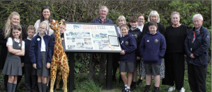 Gawber Primary School pupils, with school mascot Jeffrika, Gawber History Group and Ward Alliance members and Couns Alice and Trevor Cave at the board’s unveiling