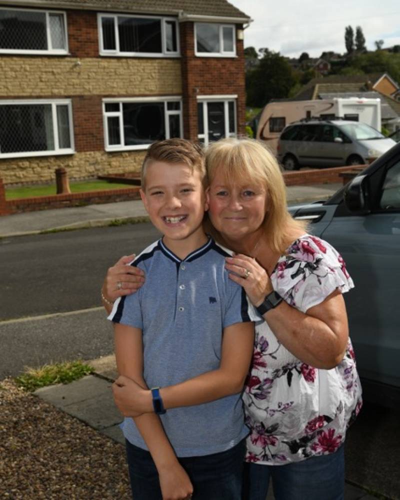 Main image for Alex, 11, helps ill neighbour with walks