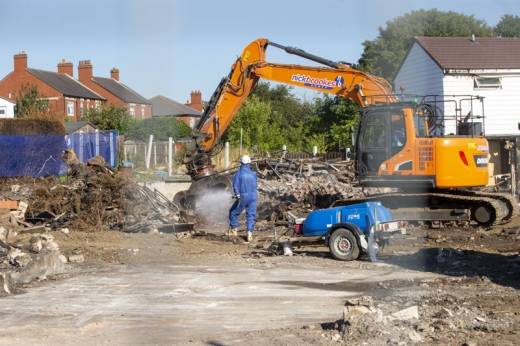 Main image for Demolition work on fire-damaged homes begins