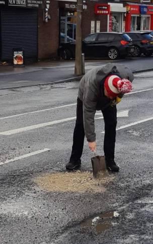 Main image for Hoyland man fills in pothole himself