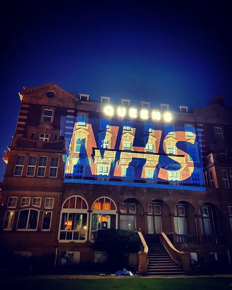 THERE FOR YOU: Queen’s Hotel lit up for NHS and (below) preparing food in the kitchen.