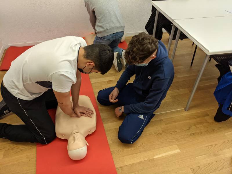 Students learning how to perform CPR
