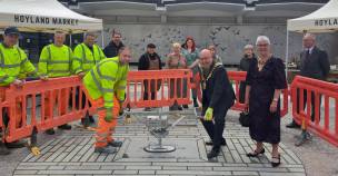 The Mayor of Barnsley, Coun Mick Stowe helps to lay the commemorative flagstone at Hoyland Town Square.