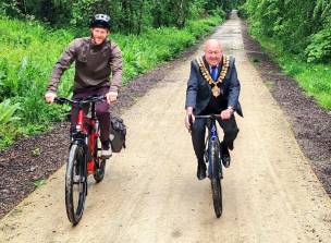 The Mayor Coun Mick Stowe and Ed Clancy put the new route to the test with a short bike race. Picture by Coun Kevin Osborne