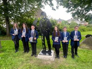 Students from Kirk Balk Academy with the new sculpture at Hoyland Common.
