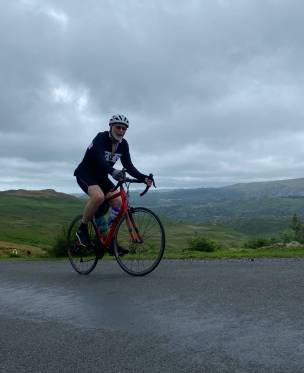 Main image for John completes mammoth bike ride for charity